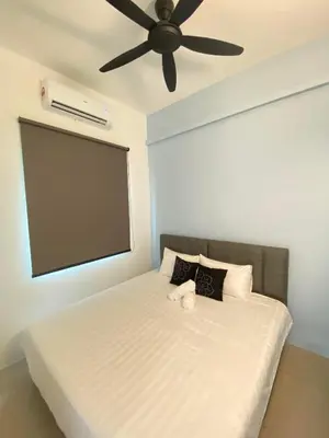 a bedroom with a bed with a ceiling fan at LYL HOMESTAY-IPOH 10Pax 4R in Ipoh