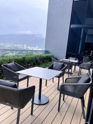 a group of tables and chairs on a balcony at Beacon Executive Suites #Georgetown #InfinityPool #15 in George Town