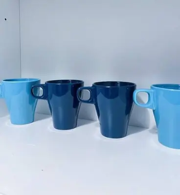 a group of blue cups sitting on a table at Beacon Executive Suites #Georgetown #InfinityPool #15 in George Town