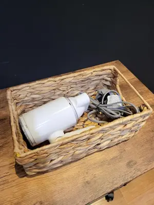 a basket with a blow dryer in it on a table at The Label Suites Ipoh in Ipoh