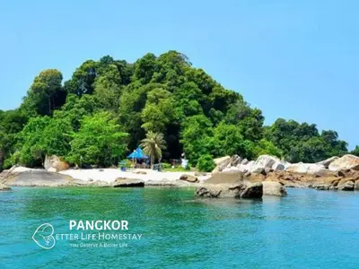 an island in the water next to a beach at Better Life Apartment near beach-2room 2bathroom 6pax in Pangkor