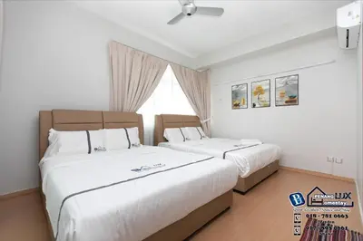 a bedroom with two beds and a window at GeorgeTown 6BR KTV Bungalow 28Pax in George Town