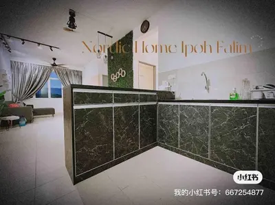 a kitchen with green tiled counters and a living room at Nordic Home Falim 31 Astro in Ipoh