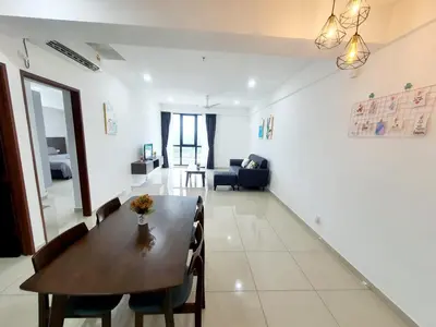 a dining room and living room with a table and chairs at LOVELY 2ROOM SUITE6PAX@SKY CONDO JURU SENTRAL in Bukit Mertajam