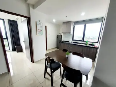 a kitchen and dining room with a table and chairs at LOVELY 2ROOM SUITE6PAX@SKY CONDO JURU SENTRAL in Bukit Mertajam