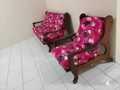 two chairs and a couch in a room at CLP perai homestay near Sri Muniswarar Temple 2 in Perai