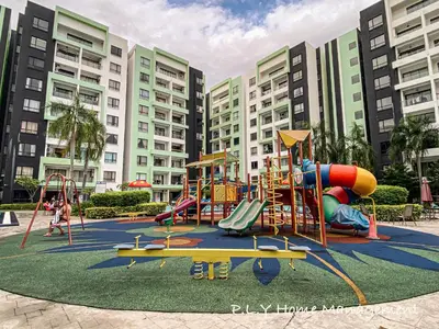 a playground in front of a large building at Comfy Suite Manhattan Ipoh PoolView Waterpark Free Netflix&Game in Ipoh