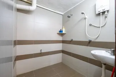a bathroom with a sink and a shower at CLP perai homstay in perai in Perai