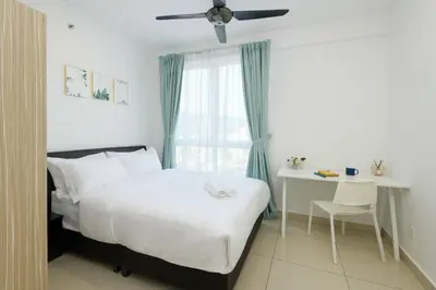 a bedroom with a bed and a desk and a window at 2R2B/Harmony Sunrise/1~8pax/Gurney/Mansion One in George Town