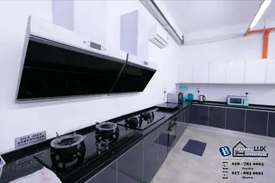 a kitchen with a large flat screen tv on the wall at Villa w/PrivatePool Golf View Snooker BBQ 10BR in Bayan Lepas