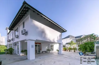 a white house with a courtyard in front of a building at Villa w/PrivatePool Golf View Snooker BBQ 10BR in Bayan Lepas